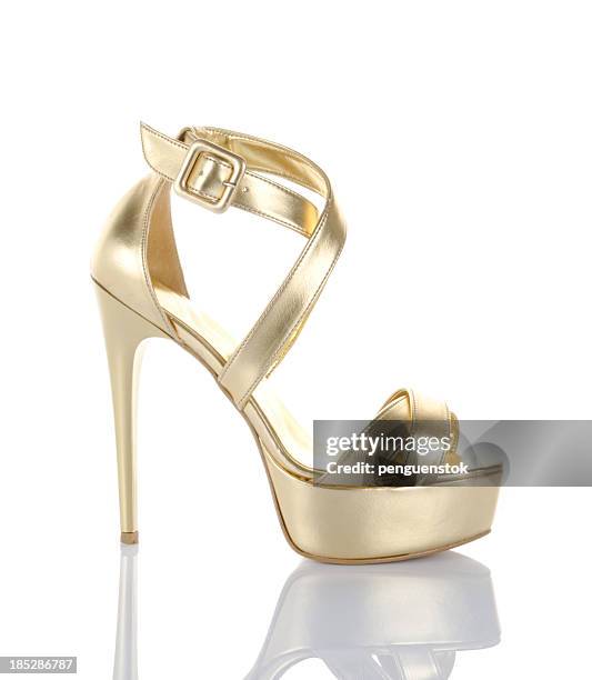 gold high heel shoe - gold high heels stock pictures, royalty-free photos & images