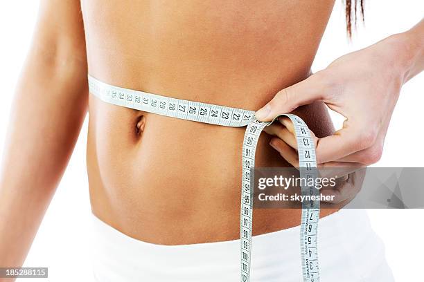 shapely waistline. - flat stomach stock pictures, royalty-free photos & images