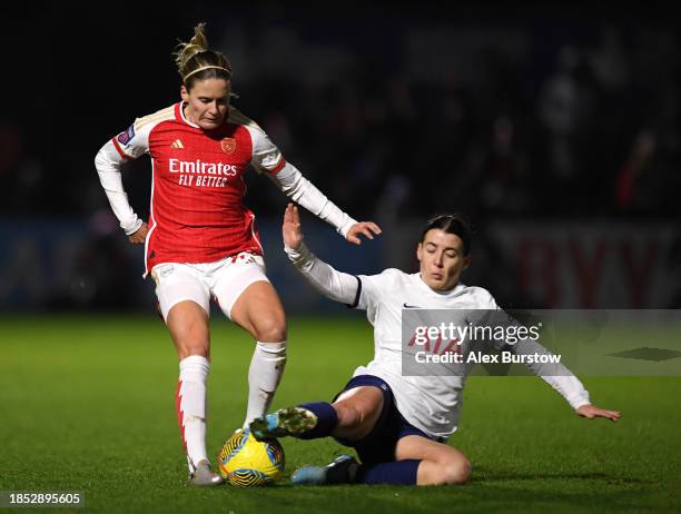 Cloe Lacasse of Arsenal is challenged by Angharad James of Tottenham Hotspur during the FA Women's Continental Tyres League Cup match between Arsenal...