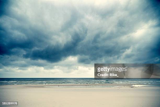 dramatic clouds over the baltic sea - beach wide stock pictures, royalty-free photos & images
