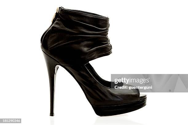 stylish high heels ankle boot in black leather. - high heels boots stock pictures, royalty-free photos & images