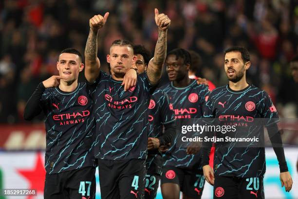 Kalvin Phillips of Manchester City celebrates with teammate Phil Foden after scoring their team's third goal during the UEFA Champions League match...