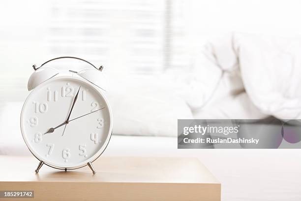 alarm clock at sleeping room. - bedside table stock pictures, royalty-free photos & images