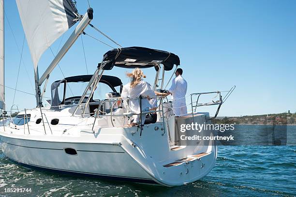 friends sailing on a yacht - ports nsw stock pictures, royalty-free photos & images