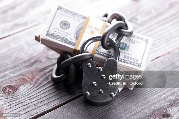 secure money - miserly stock pictures, royalty-free photos & images