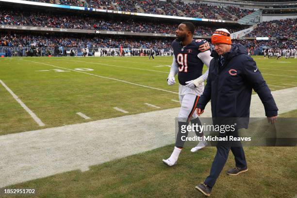 Yannick Ngakoue of the Chicago Bears leaves the field after being injured against the Detroit Lions during the fourth quarter at Soldier Field on...