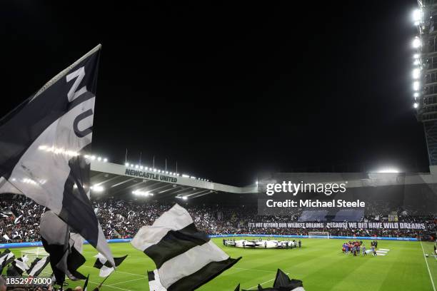 General view inside the stadium as fans of Newcastle United wave flags in support prior to the UEFA Champions League match between Newcastle United...