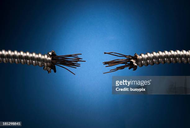 damaged conduit with exposed wires - frayed stock pictures, royalty-free photos & images