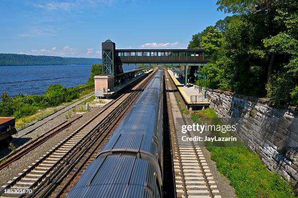commuter railroad train near hudson river, bronx, new york city - the bronx stock pictures, royalty-free photos & images