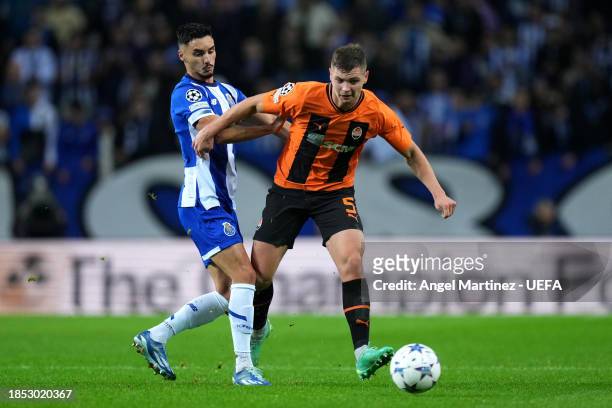 Stephen Eustaquio of FC Porto challenges Valeriy Bondar of FC Shakhtar Donetsk during the UEFA Champions League match between FC Porto and FC...