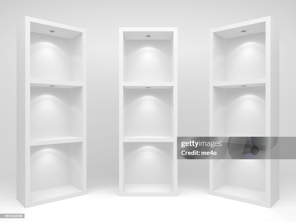 Three white cd racks or bookcases on a white background