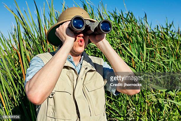 bird watcher on safari - spy hunter stock pictures, royalty-free photos & images