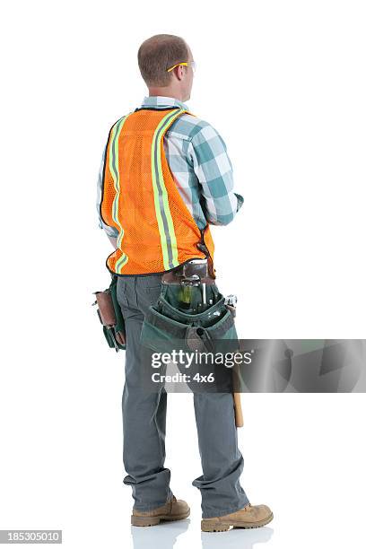 rear view of a manual worker standing - blue collar construction isolated bildbanksfoton och bilder