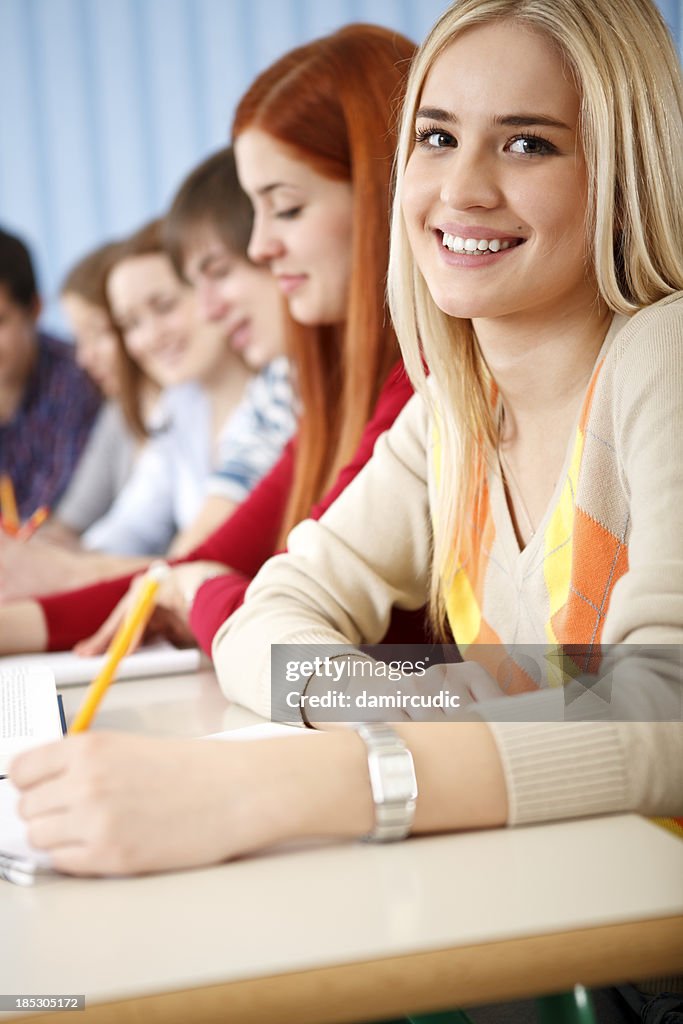 Beautiful female college student smiling in the classroom