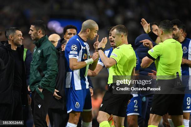 Pepe of FC Porto reacts as referee, Istvan Kovacs shows a yellow card to Sergio Conceicao, Head Coach of FC Porto, during the UEFA Champions League...
