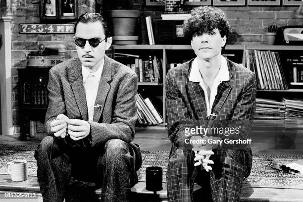 View of American sibling Rock and Pop musicians Ron Mael and Russell Mael, both of the group Sparks as they sit on a low stage during an interview on...