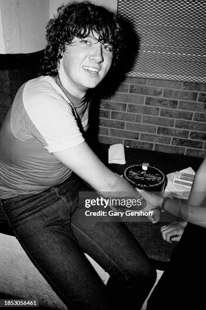 View of English Rock singer Joe Elliott, of the group Def Leppard, backstage at the Palladium, New York, New York, August 1, 1980. Visible on the...