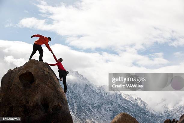 assist - teamwork mountain stock pictures, royalty-free photos & images