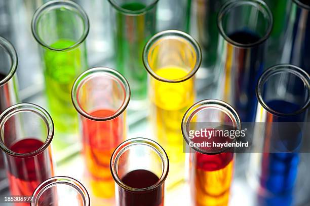 coloured test tubes shallow dof - chemistry stock pictures, royalty-free photos & images