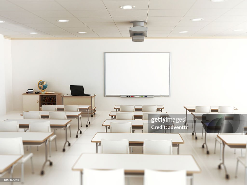 Empty classroom with white tables and chairs