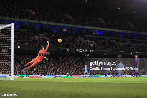 Crystal Palace goalkeeper Dean Henderson dives to make a save during the Premier League match between Manchester City and Crystal Palace at Etihad...