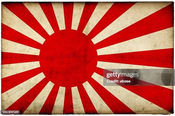 grunge rising sun flag on rough edged old postcard - japanese flag stock pictures, royalty-free photos & images