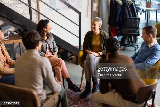 diverse business people having meeting at startup office - team building stock pictures, royalty-free photos & images