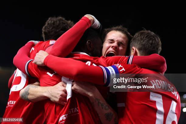 Emmanuel Latte Lath of Middlesbrough celebrates with teammates after scoring their team's first goal during the Sky Bet Championship match between...