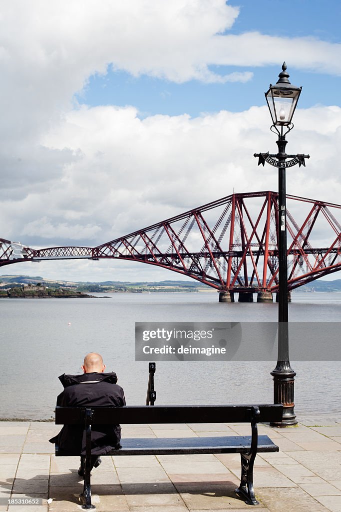 Single Man Sitting on Bench