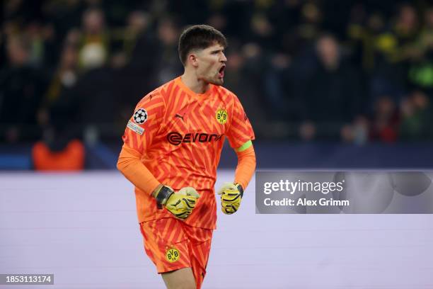 Gregor Kobel of Borussia Dortmund celebrates after teammate Karim Adeyemi scores their team's first goal during the UEFA Champions League match...