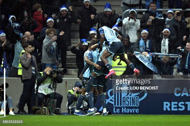 Le Havre's players celebrate after scoring the team's third goal during the French L1 football match between Le Havre AC and OGC Nice at The Stade...