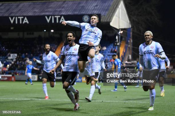 Olly Scott of Aldershot Town celebrates his goal to make it 0-1 during the Emirates FA Cup Second Round Replay match between Stockport County and...