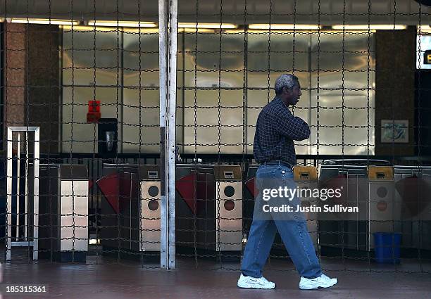 Man walks by a shuttered Bay Area Rapid Transit station on the first day of the BART strike on October 18, 2013 in Berkeley, California. For the...