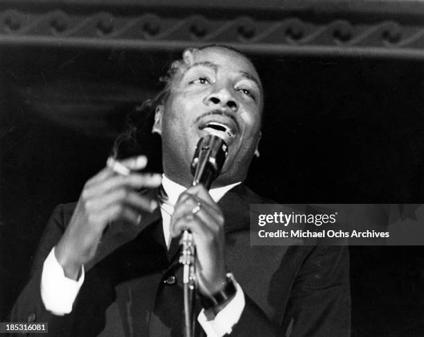 Comedian Dick Gregory performs onstage in circa 1961.