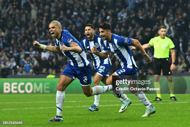 Pepe of FC Porto celebrates with teammates after scoring their team's fourth goal during the UEFA Champions League match between FC Porto and FC...
