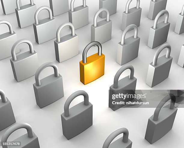 one gold padlock among many grey - password strength stock pictures, royalty-free photos & images