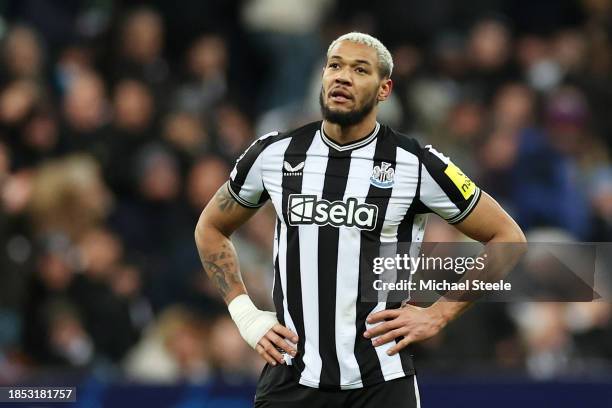 Joelinton of Newcastle United looks dejected after Samuel Chukwueze of AC Milan scores their team's second goal during the UEFA Champions League...