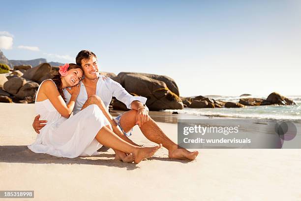young couple together at the beach - papua new guinea beach stock pictures, royalty-free photos & images