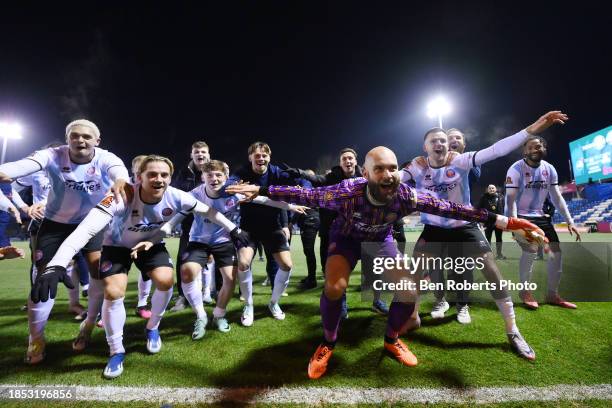 Aldershot Players celebrate after winning in the Emirates FA Cup Second Round Replay match between Stockport County and Aldershot Town at Edgeley...