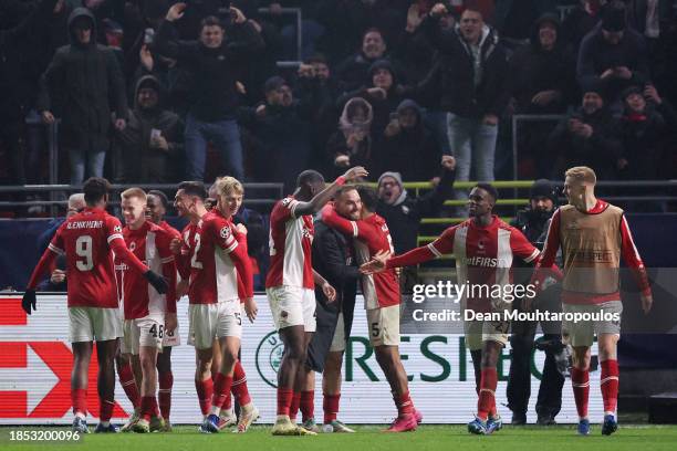 George Ilenikhena of Royal Antwerp celebrates with teammates after scoring their team's third goal during the UEFA Champions League match between...