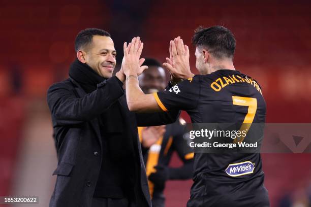 Liam Rosenior, Manager of Hull City, celebrates victory with Ozan Tufan of Hull City following the Sky Bet Championship match between Middlesbrough...