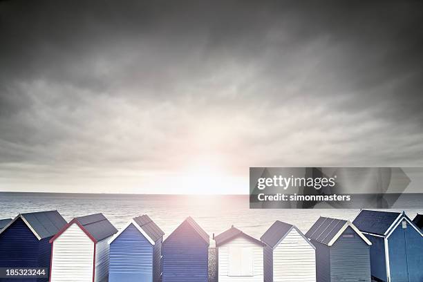 beach hut sunset - beach shelter stockfoto's en -beelden