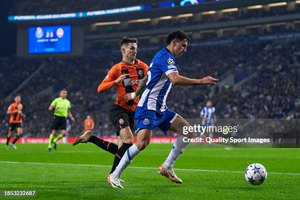 Dmytro Kryskiv of Shakhtar Donetsk competes for the ball with Jorge Sanchez of FC Porto during the UEFA Champions League match between FC Porto and...