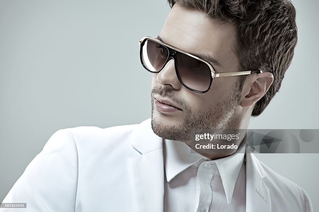 Close up of good looking man wearing sunglasses