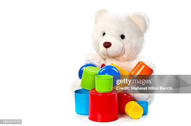 teddy bear playing balls and buckets - teddy bear isolated stock pictures, royalty-free photos & images