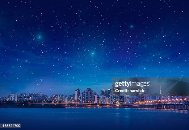 big city by starry night - evening sky bildbanksfoton och bilder