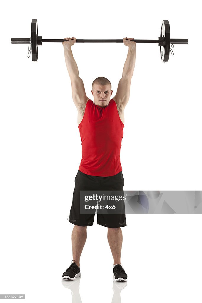 Man exercising with barbells