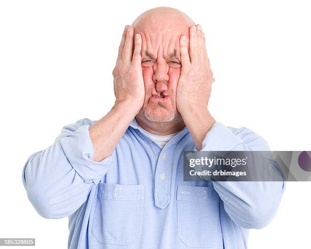 stressed man squishes face in hands - scrunched up face stock pictures, royalty-free photos & images