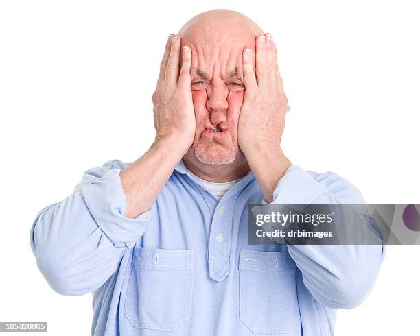 stressed man squishes face in hands - overweight 40 year old male concerned stock pictures, royalty-free photos & images