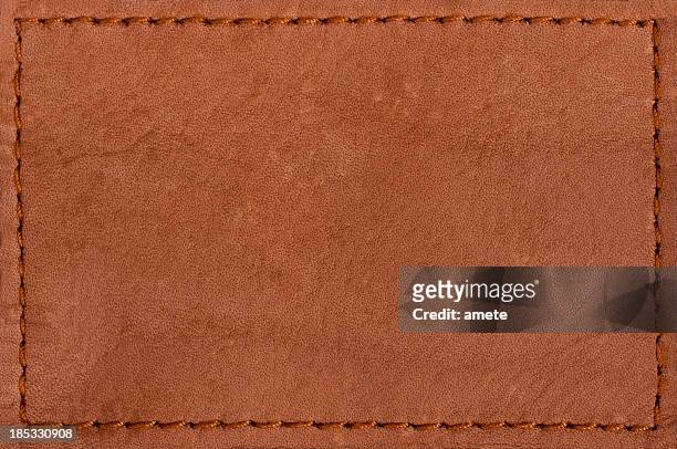 vaqueros de la etiqueta de cuero blanco - leather fotografías e imágenes de stock